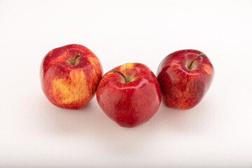Apples are red-yellow, juicy on a light background