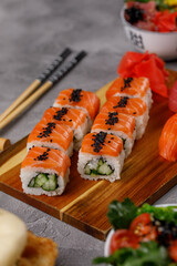 Philadelphia roll with cucumber and sushi with salmon and tuna. Sushi menu. Japanese food.