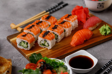 Philadelphia roll with cucumber and sushi with salmon and tuna. Sushi menu. Japanese food.