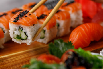 Philadelphia roll with cucumber and sushi with salmon and tuna. Sushi menu. Japanese food.