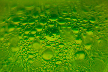 Abstract Underwater Green Illuminated Bubbles Background