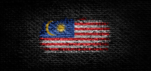 National flag of the Malaysia on dark fabric