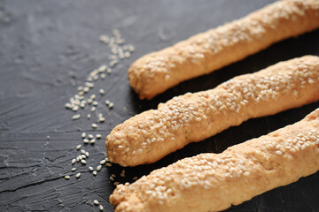 bread sticks for kids breakfast. homemade mini sticks made of cheese and flour. sesame sticks for kids.
