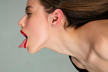 Long hair woman. Haircare. Sexy girl shows tongue. Woman cosmetics. Skin care.