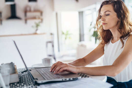 Portrait of student girl working on laptop