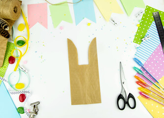 DIY and kids creativity. Step by step instructions: how to make an Easter bunny packaging from a craft bag. Step4. Easter handmade craft.