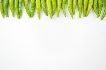 Green Thai chile peppers vary in size and shape, depending on the specific variety, and are generally small, conical, and slender, tapering to a point on the non-stem end.