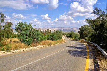 Naklejka premium Empty Curved Roadway in Picturesque Israeli Countryside - Israel