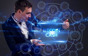 Business, Technology, Internet and network concept. Young businessman working on a virtual screen of the future and sees the inscription: Bitcoin cash