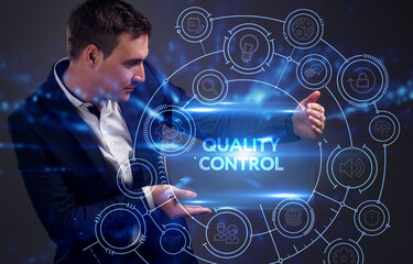 Business, Technology, Internet and network concept. Young businessman working on a virtual screen of the future and sees the inscription: Quality control