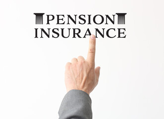 Male hand pointing at text PENSION INSURANCE on light background