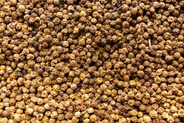 Dried peppercorns. Texture background. Dry pepper spice.
