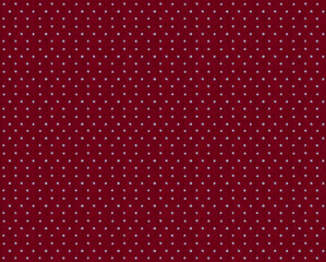 seamless texture of red cotton fabric with small white polka dots 