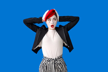 Female pantomimist on color background