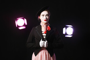 Female pantomimist on dark background