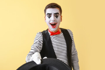 Male pantomimist on color background