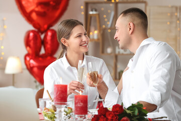 Young couple celebrating Valentine's Day at home