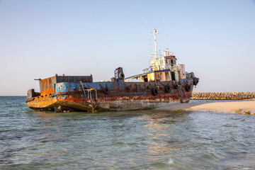 old abandoned fishing boat on a beach