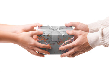 Female and male hands hold the gift box. A concept for holidays, gifts, and discounts.