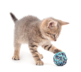 Fototapeta na wymiar Little kitten playing with a ball of yarn.