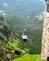 View from the top railway station at Kasprowy Wierch mountain to the cable car belonging to Polish Cableways   (Polish: PKL - Polskie Koleje Linowe). Polish Tatra Mountains, near Zakopane ski resort. 