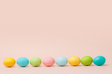 Happy Easter card with abstract minimal scene with easter eggs in cream colors.