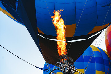 Obraz premium Close up of hot air balloon getting prepared for flight