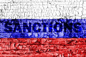 The flag of the Russia on a cracked wall with the words 
