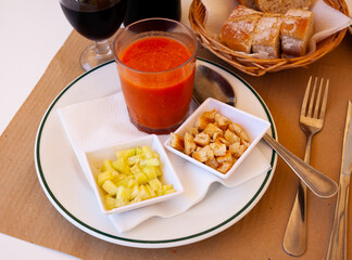 Gazpacho is a cold spanish soup from tomatoes, served with cucumbers and baked bread