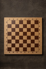 Empty chess board on dark background