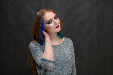 Beauty fashion model girl with excellent makeup. Portrait of a beautiful girl with dyed hair, professional hair coloring.