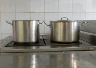 metal pot on the stove top, school kitchen, eat cooking concept