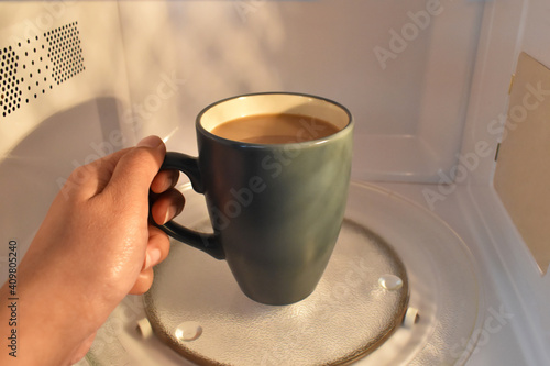 Cup Of Tea Or Coffee In Microwave Concept Of Heating Your Drink In Microwave Wall Mural Maliflower73 Cup Of Tea Or Coffee In Microwave Concept Of Heating Your Drink In Microwave Wall Mural Maliflower73