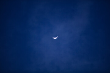 Obraz na płótnie Canvas Half Moon photographed through a long focal lens.