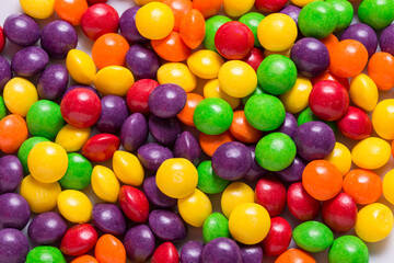 Fototapeta na wymiar Lot of bright sweet candy, colored background