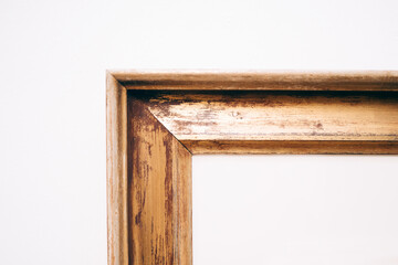 part of empty picture frame on white wall