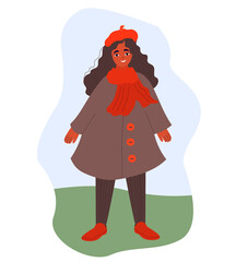 Cute curly-haired girl stands in a coat and a red cap, the girl smiles against the background of the spring landscape
