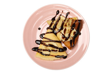 Plate of crepes with chocolate sauce and banana slices isolated on white background