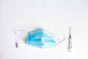 Ampoules with Covid-19 vaccine on white background. Vaccination concept