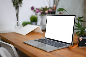 Fototapeta premium Mock up laptop computer with blank screen on photographer workspace.