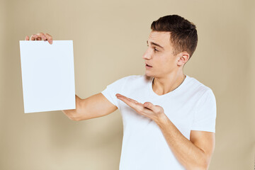 man holding white sheet of paper in hand billboard copy space office