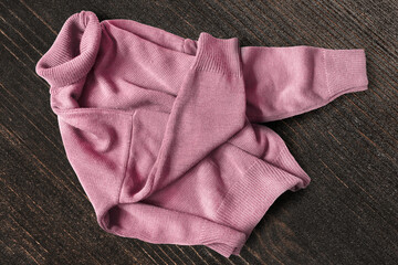 Sweater on wooden background