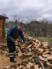 a picture of a man breaking wood