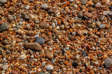 Pebbles and rocks on the beach of the Mediterranean Sea in Israel