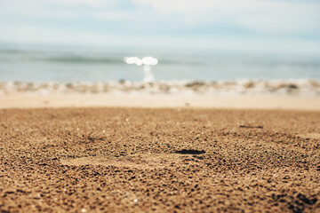Foot prints on a sandy beach. Beach travel, vocation concept.