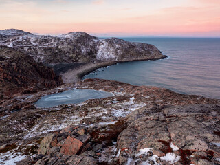 A hard-to-reach promontory jutting out into the sea and a curved coastline. Tracking on the Kola Peninsula.