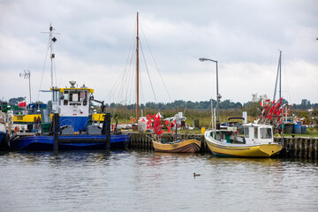  Fishing boats in port on the Vistula Lagoon in Katy Rybackie village located on the Vistula Spit between lagoon and Baltic Sea in Poland