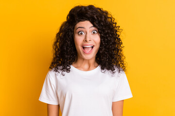 Photo of young happy excited crazy shocked amazed surprised girl sees big sale discount isolated on yellow color background