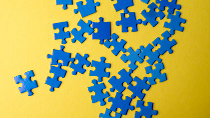 scattered puzzle pieces on colored background