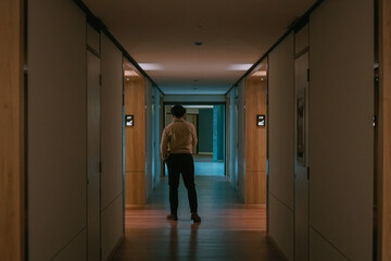 Man walk alone in the middle of corridor